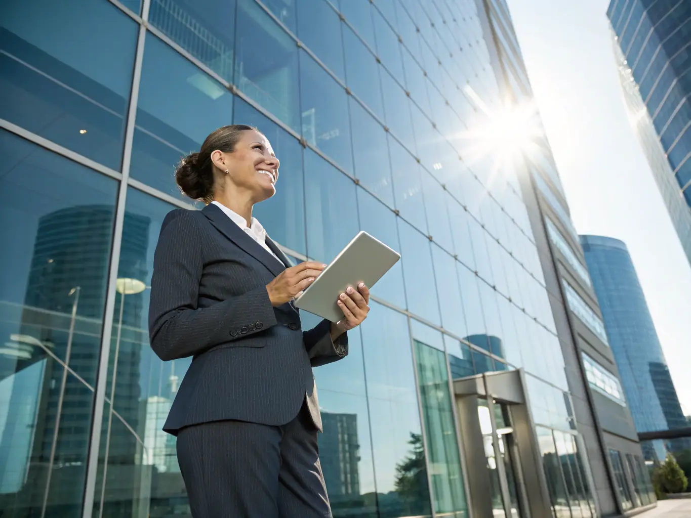 A confident entrepreneur standing in front of a modern office building, symbolizing leadership and success, with a focus on personal empowerment and professional growth.