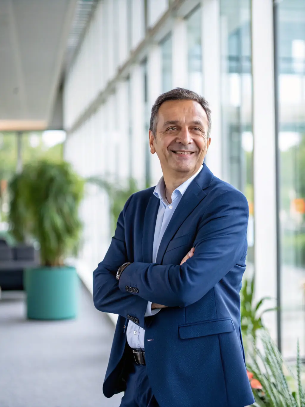 A UK business owner reflecting on personal growth and professional achievements, with a coach providing guidance and support in a serene environment.